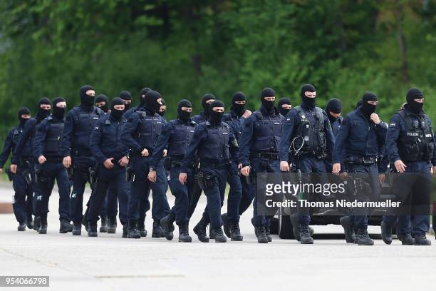 Police is seen at the main refugee center during an intervention there by riot police on May 3, 2018 in Ellwangen, Germany. Police raided the...