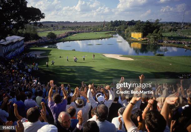 The crowd cheers as Europe retain the Ryder Cup after Christy O''Connor secures victory over Fred Couples of the USA during the Final Day Singles at...