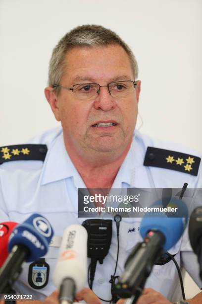 Director of operations, Peter Hoenle talks to the media at the main refugee center after an intervention there by riot police on May 3, 2018 in...