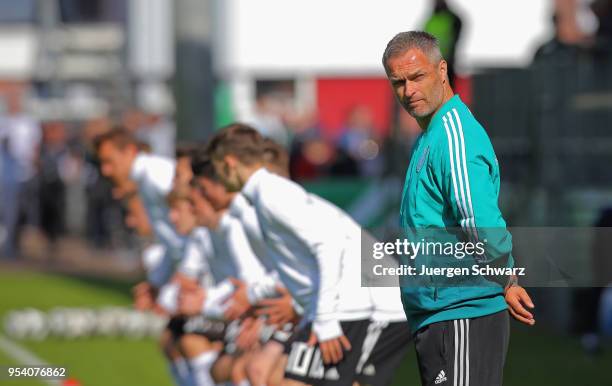 Manager Christian Wueck of Germany watches his team warming up prior to the international friendly match between U15 Germany and U15 Netherlands on...