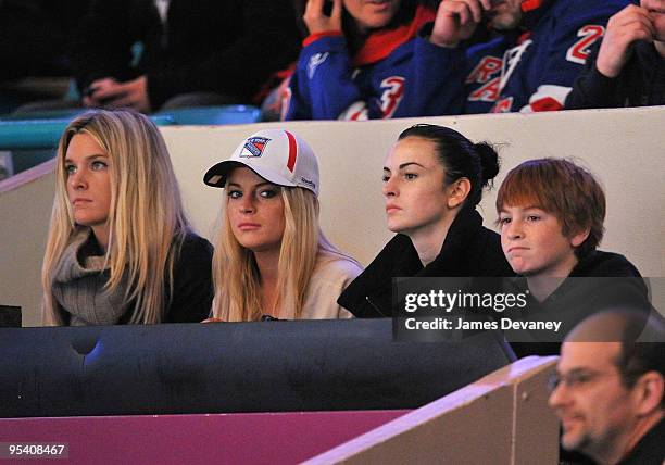 Lindsay Lohan, Ali Lohan and Dakota Lohan attend the New York Islanders vs New York Rangers game at Madison Square Garden on December 26, 2009 in New...