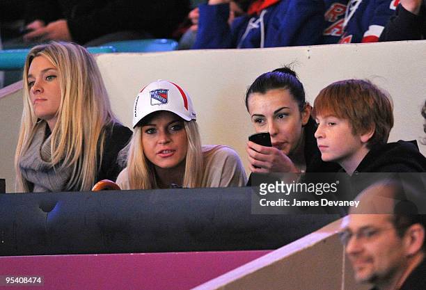 Lindsay Lohan, Ali Lohan and Dakota Lohan attend the New York Islanders vs New York Rangers game at Madison Square Garden on December 26, 2009 in New...