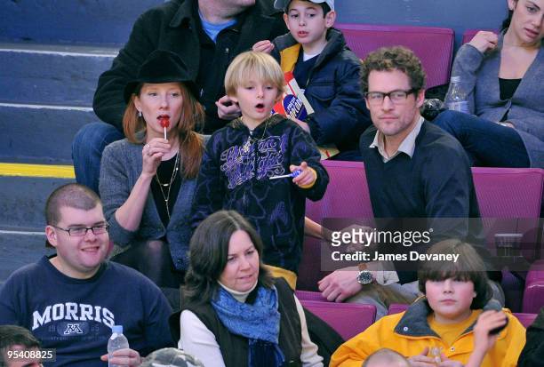 Anne Heche, Homer Heche Laffoon and James Tupper attend the New York Islanders vs New York Rangers game at Madison Square Garden on December 26, 2009...