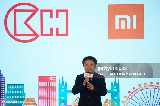 Xiang Wang, senior vice president for Xiaomi speaks during a joint press conference with CK Hutchison in Hong Kong on May 3, 2018. - Chinese...