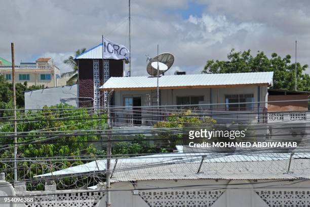 Picture taken on May 3, 2018 shows the flag of the International Committee of the Red Cross at their compound where armed men kidnapped a German...