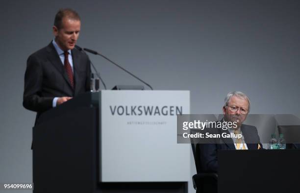 Wolfgang Porsche , Chairman of the Supervisory Board of Porsche Automobil Holding AG, looks on as Herbert Diess, the newly-appointed chairman of...