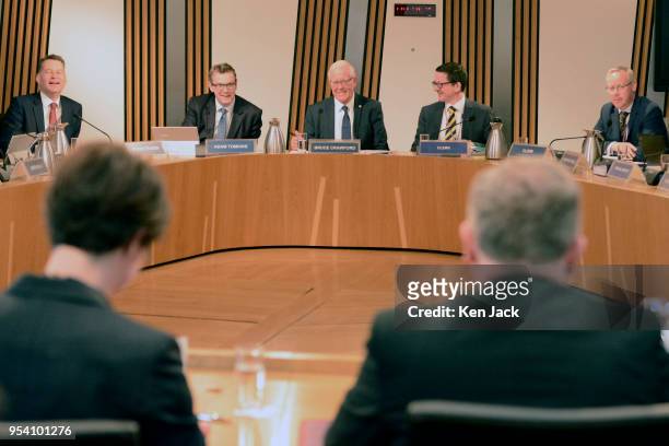 Committee Convener Bruce Crawford prepares to take evidence from David Mundell , Secretary of State for Scotland in the UK Government, and Chloe...