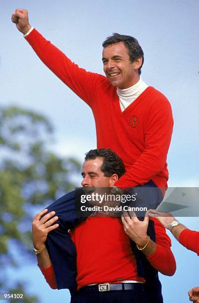 European team captain Tony Jacklin celebrates as he sits on the shoulders of Sam Torrance after victory in the Ryder Cup at the Belfry in Sutton...