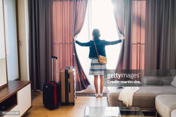 tourist woman staying in luxury hotel - staying in hotel imagens e fotografias de stock