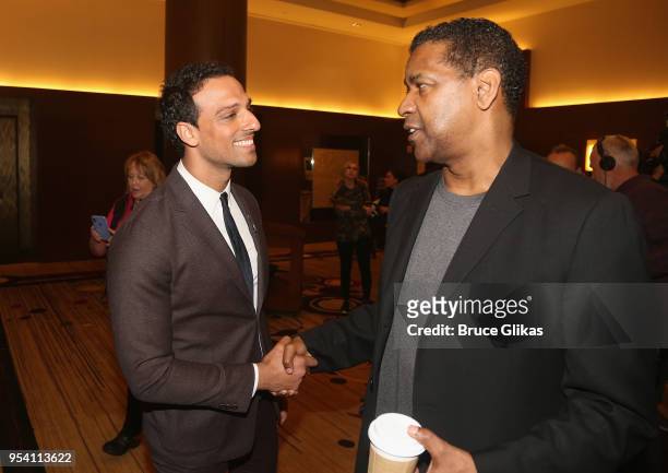 Ari'el Stachel and Denzel Washington chat at The 2018 Tony Award "Meet The Nominees" photo call & press junket at The Intercontinental New York Times...