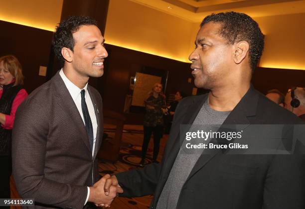 Ari'el Stachel and Denzel Washington chat at The 2018 Tony Award "Meet The Nominees" photo call & press junket at The Intercontinental New York Times...