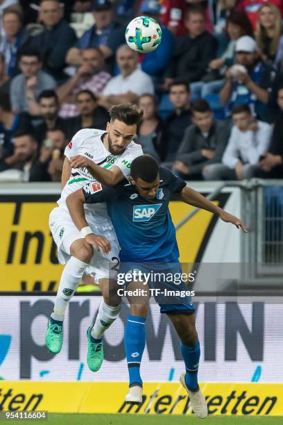 Kenan Karaman of Hannover and Kevin Akpoguma of Hoffenheim battle for the ball during the Bundesliga match between TSG 1899 Hoffenheim and Hannover...