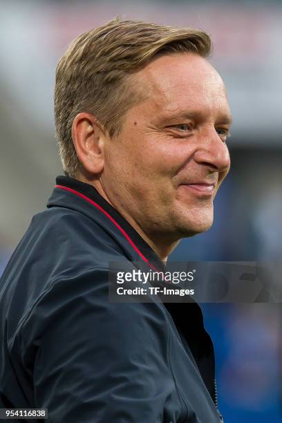 Manager Horst Heldt of Hannover looks on prior to the Bundesliga match between TSG 1899 Hoffenheim and Hannover 96 at Wirsol Rhein-Neckar-Arena on...