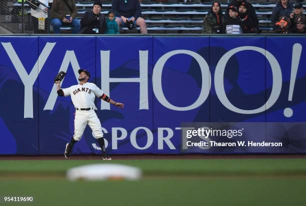 Gregor Blanco of the San Francisco Giants catches a fly ball off the bat of Manuel Margot of the San Diego Padres in the top of the first inning at...