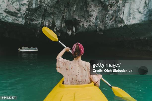 woman kayaking in halong bay - halong bay stock pictures, royalty-free photos & images