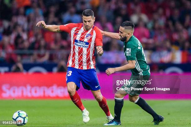 Victor Machin, Vitolo, of Atletico de Madrid fights for the ball with Ryad Boudebouz of Real Betis during the La Liga match between Atletico Madrid...