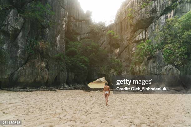 woman walking on beach in halong bay - vietnam strand stock pictures, royalty-free photos & images