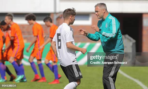 Manager Christian Wueck of Germany talks to Leon Fust during the international friendly match between U15 Germany and U15 Netherlands on May 3, 2018...