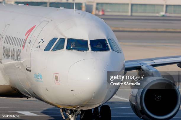 An Asiana Airlines Airbus A321 taxis down the runway at Gimpo International Airport on 17 April 2018, in Seoul, South Korea. Korea's budget carriers...