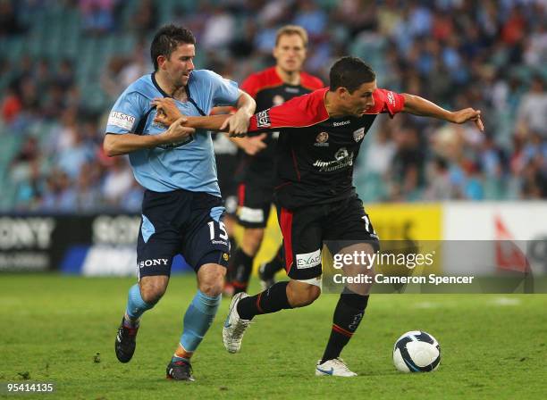 Terry McFlynn of Sydney FC and Matthew Leckie of United FC contest the ball during the round 21 A-League match between Sydney FC and Adelaide United...