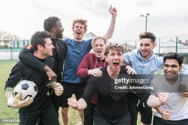 team cheering football match success - only young men stock pictures, royalty-free photos & images