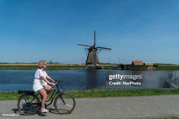 Kinderdijk windmills landmark in The Netherlands during a sunny day. Kinderdijk is a mill network in the province of South Holland near Rotterdam...