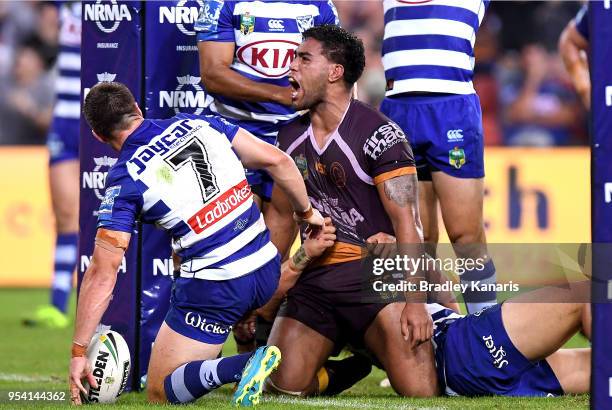 Joe Ofahengaue of the Broncos celebrates scoring a try during the round nine NRL match between the Brisbane Broncos and the Canterbury Bulldogs at...