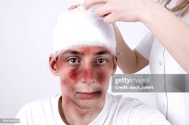 head injury suffering - head bandage stock pictures, royalty-free photos & images