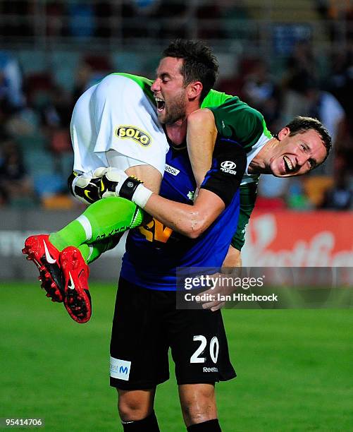 Justin Pasfield and Matthew Smith of the Fury celebrate after wining the round 21 A-League match between the North Queensland Fury and the Melbourne...