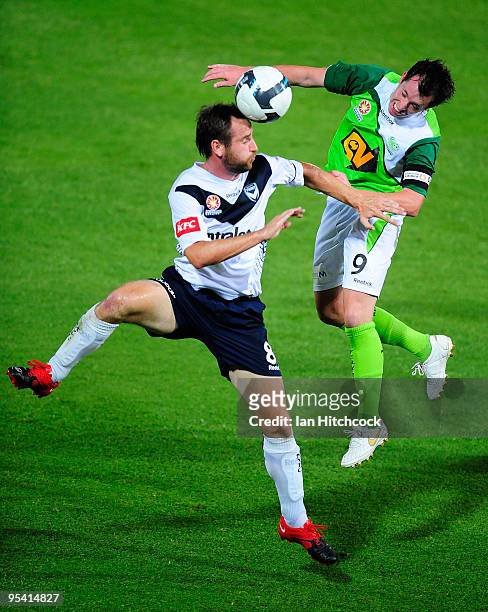 Robbie Fowler of the Fury and Grant Brebner of the Victory contest the ball during the round 21 A-League match between the North Queensland Fury and...