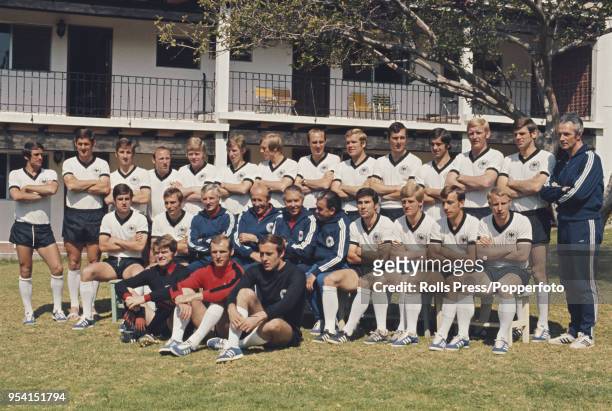 The West Germany national team squad line up together in the garden of the Hotel Balneario in Comanjilla, Mexico prior to competing in the 1970 FIFA...