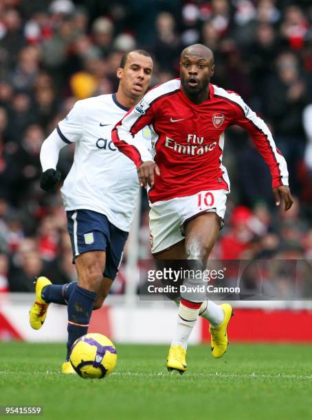 William Gallas of Arsenal battles for the ball with Gabriel Agbonlahor of Aston Villa during the Barclays Premier League match between Arsenal and...