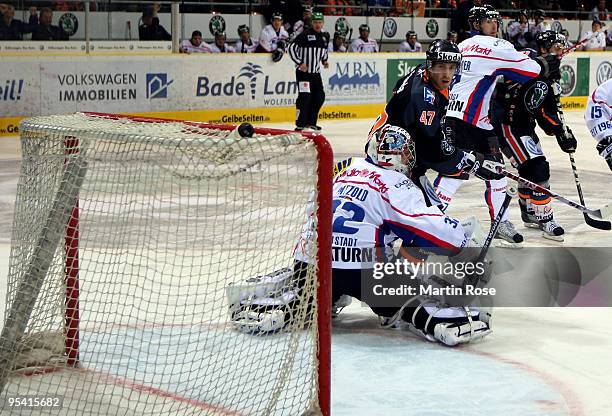 Mike Green of Wolfsburg tries to score over Dimitri Paetzold , goalkeeper of Ingolstadt during the DEL match between Grizzly Adams Wolfsburg and ERC...