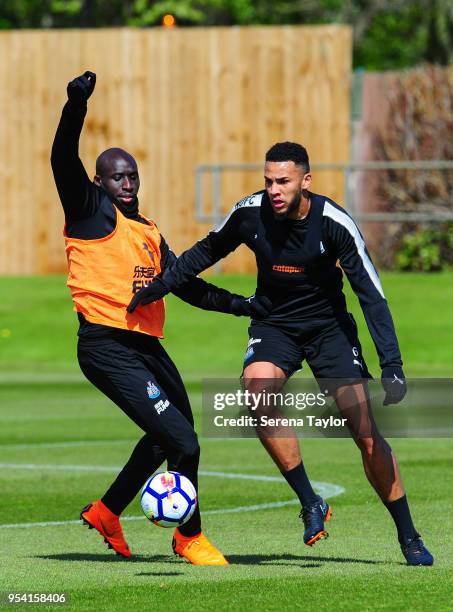 Mohamed Diame and Jamaal Lascelles jostle for the ball during the Newcastle United Training Session at the Newcastle United Training Centre on May 3...