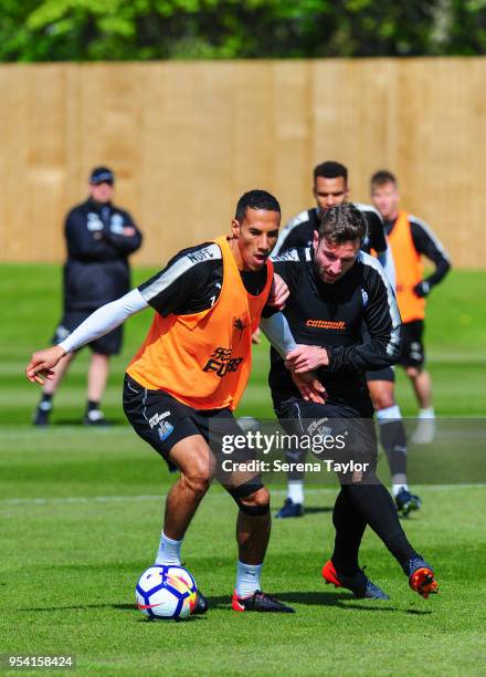 Isaac Hayden and Paul Dummett jostle for the ball during the Newcastle United Training Session at the Newcastle United Training Centre on May 3 in...