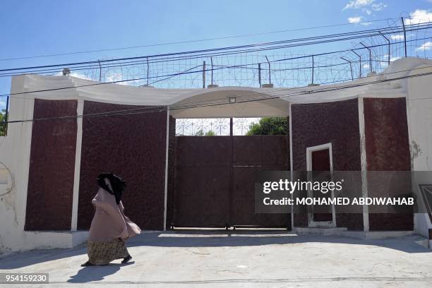 Woman walks in front of the compound of the International Committee of the Red Cross where armed men kidnapped a German nurse on May 3 evening in...