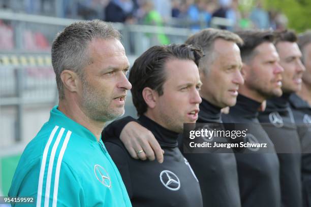 Manager Christian Wueck of Germany and his team sing the national anthem prior to the international friendly match between U15 Germany and U15...