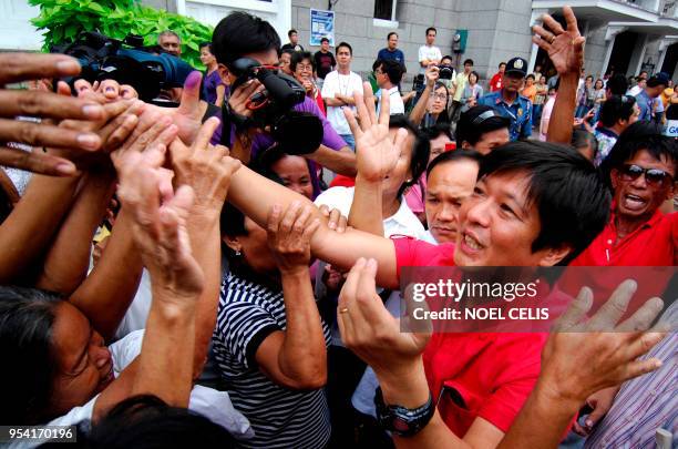 Ferdinand 'Bongbong' Marcos Jr., the son of former president Ferdinand Marcos greets supporters as he files his Certificate of Candidacy at the...