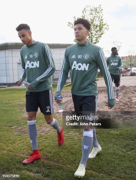 Millen Baars and Nishan Burkart of Manchester United U18s in action during an U18s training session at Aon Training Complex on May 2, 2018 in...