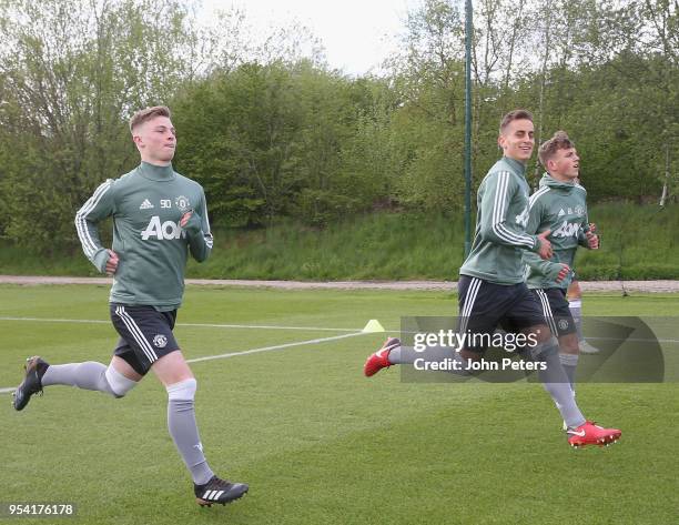 George Tanner, Millen Baars and Dion McGhee of Manchester United U18s in action during an U18s training session at Aon Training Complex on May 2,...