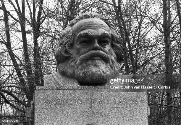 Karl Marx headstone at East Highgate cemetery with the engraving "Workers of all lands unite" on March 15, 1983 in London, England. Karl Marx was...