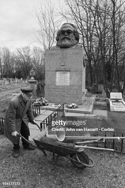 Gardener takes care of Karl Marx's grave site and tomb at East Highgate cemetery on March 15, 1983 in London, England. Karl Marx was born on May 5,...