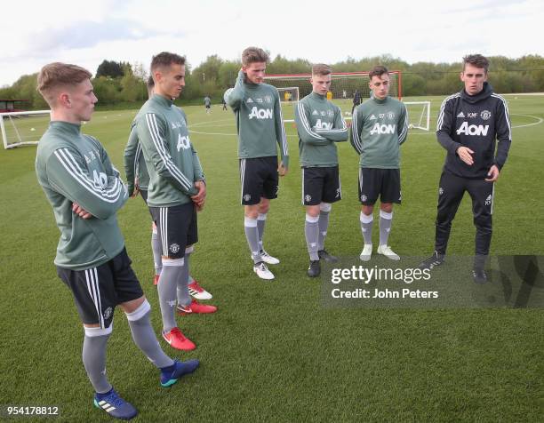 Ethan Galbraith, Millen Baars, Max Dunne, George Tanner, Lee O'Connor and Manager Kieran McKenna of Manchester United U18s in action during an U18s...