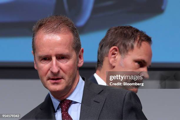 Herbert Diess, chief executive officer of Volkswagen AG , left, and Oliver Blume, chief executive officer of Porsche AG, arrive for the automaker's...