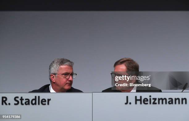 Rupert Stadler, chief executive officer of Audi AG, left, sits beside Jochem Heizmann, head of China at Volkswagen AG , during the VW annual general...