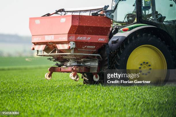 Tractor fertilises a field on April 30, 2018 in Meuselwitz, Germany.