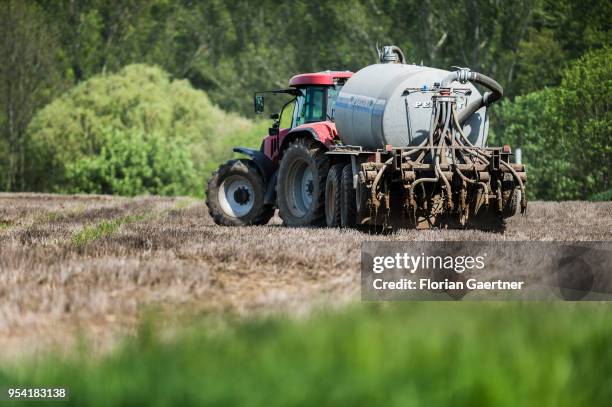 Tractor spreads liquid manure on a field on April 30, 2018 in Biesig, Germany.