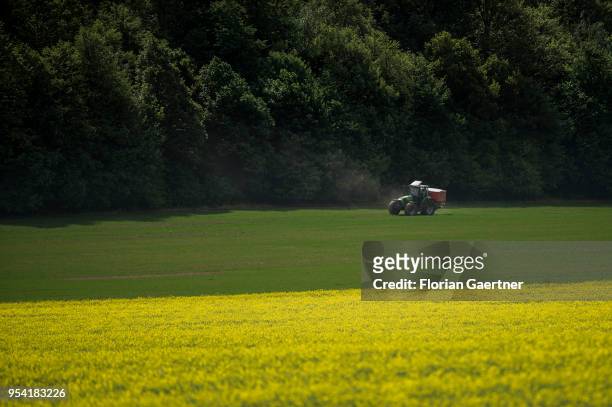 Tractor fertilises a field on April 30, 2018 in Koenigshain, Germany.