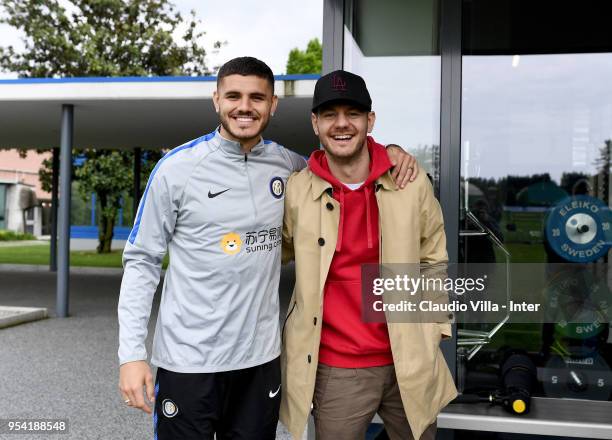 Mauro Icardi of FC Internazionale and Alessandro Cattelan pose for a photo during the FC Internazionale training session at the club's training...