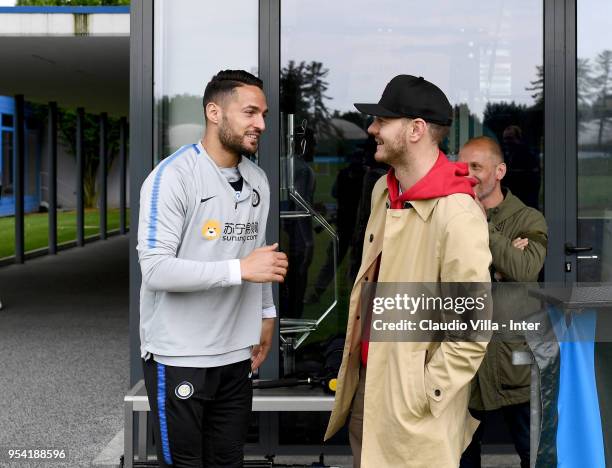 Danilo D'Ambrosio of FC Internazionale and Alessandro Cattelan pose for a photo during the FC Internazionale training session at the club's training...